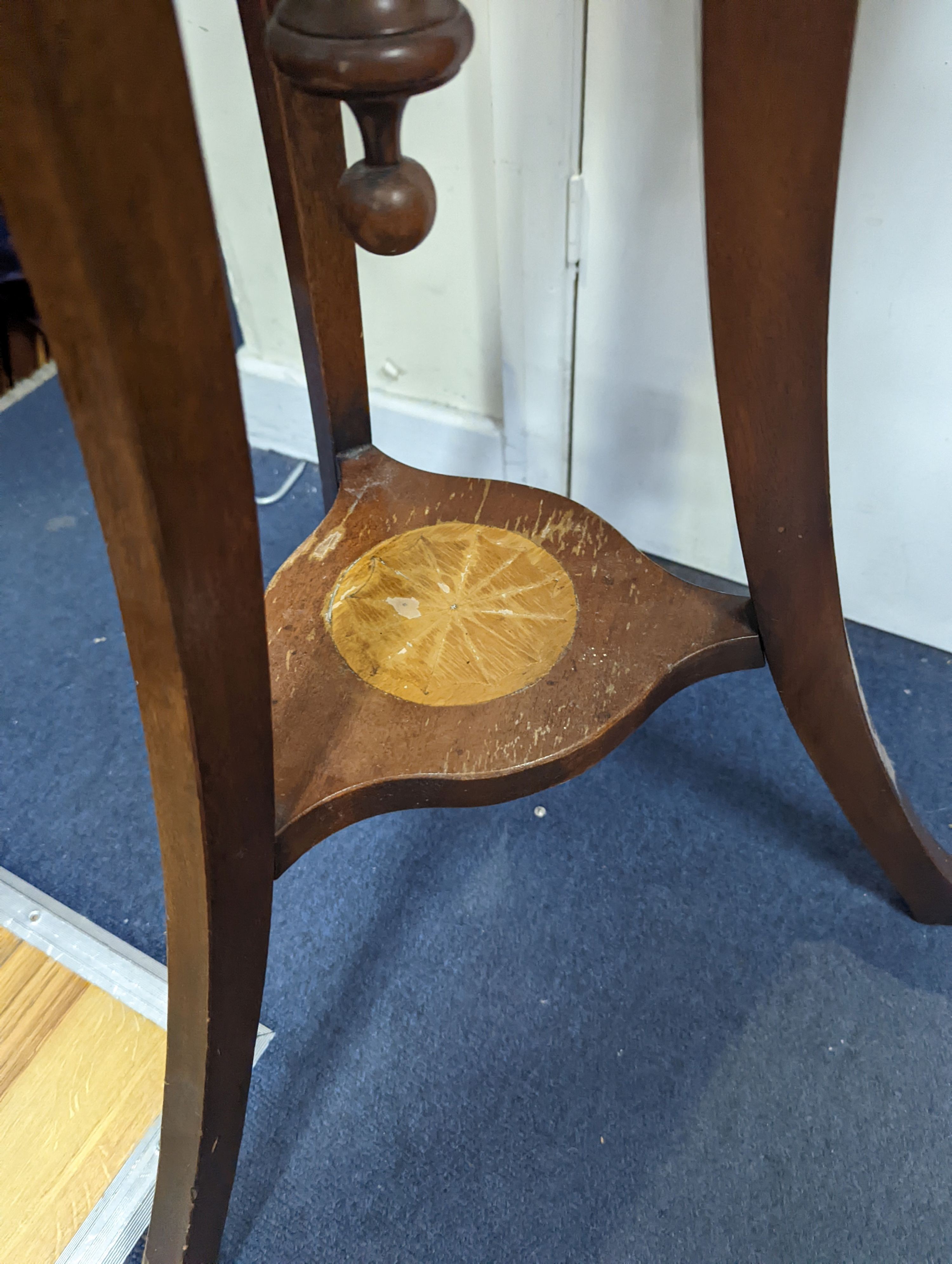 An Edwardian style inlaid mahogany jardiniere with brass liner, diameter 35cm, height 85cm